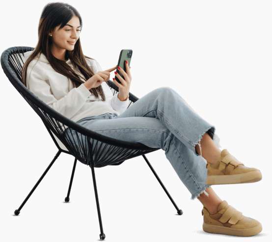 A women relaxing on a couch and ordering food using her mobile phone